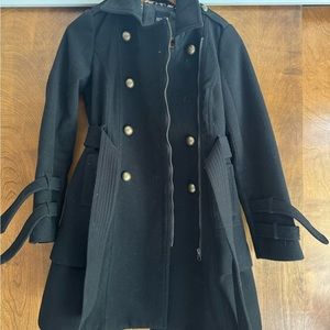 Womens XOXO peacoat. Black with gold buttons and a gold zipper. Leopard inside.